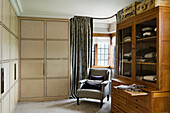Dressing room with satinwood store cupboards and oak cabinet