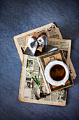 Old newspaper, gift, book, cup of coffee and flower