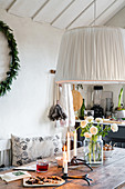 Wintry arrangement on dining table in kitchen-dining room