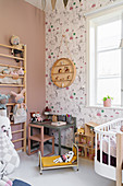 Wall bars and play table in vintage-style girl's bedroom