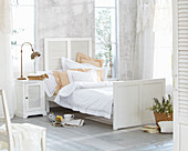 White country-house furniture in summery bedroom