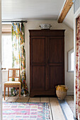 Old wooden cupboard in interior of renovated Swedish house