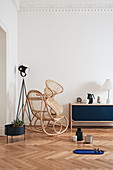 Rattan rocking chair, standard lamp and low sideboard