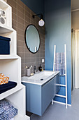 Modern bathroom in blue, grey and white
