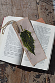 Handmade bookmarks with painted leaf motif
