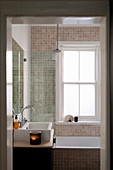 Small bathroom with beige mosaic tiles