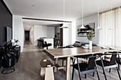 Modern, open-plan interior with colour scheme in shades of grey