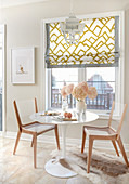 Breakfast nook in kitchen with Roman blind and lantern lamp