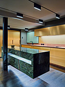 Designer kitchen with marble counter in open-plan interior