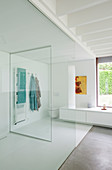 Large, modern bathroom with glass partition walls