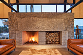 Designer fireplace in open-plan interior