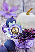 White pumpkins, passion flower, elderberries and figs