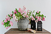 Arrangement of flowering rose branches in vase