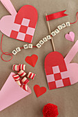 Love note on string of lettered beads and paper love hearts