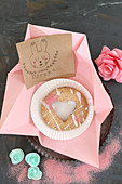 Handmade Easter card and biscuit with heart-shaped cut-out