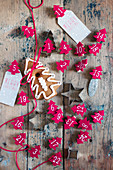 Numbered Christmas trees made from red felt and pastry cutters