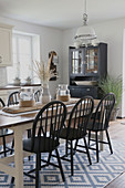 Dining area in modern country style with summery decorations