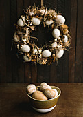 Easter wreath and bowl of Easter eggs