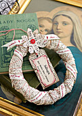 Straw wreath wrapped with old book pages as a Christmas decoration