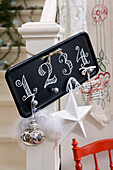 Black chalkboard painted tray with numbers as an Advent decoration