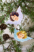 DIY Christmas tree ornaments made from an angel picture and a clothespin