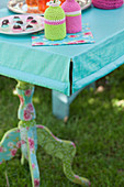 Handmade tablecloth with slit corners and weights