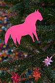 Homemade horse made of pink paper as a Christmas tree decoration