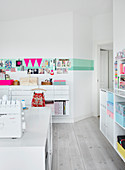 organization and storage ideas in the white craft room
