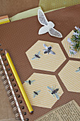 Honeycombs and bees made of paper on a ring binder