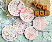 Decorative cardboard ornaments decorated with paper doilies