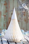 White fir tree folded from pleated accordion paper