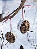 Homemade bird food station from nostalgic cups