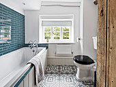 Modern and bright bathroom with blue accents