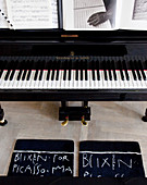 Carpets with handwritten print in front of the piano