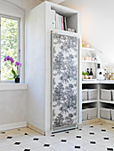 Refrigerator covered with toile de jouy wallpaper