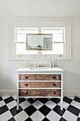 Chest of drawers with undermount sink below window