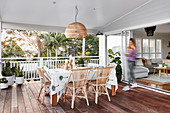 Dining table and rattan chairs on terrace