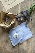Handmade lavender sachets and lavender flowers in handcrafted paper box