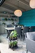Modern dining room with blue wallpaper in summerhouse