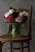 Bouquet of ranunculus on a chair