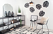 Designer chair and shelving in black-and-white interior