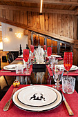 Festively set table in dining area of chalet