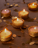 Golden tealight holders as festive table decorations