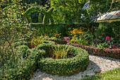 Knot garden and artfully cut hedge