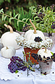 White pumpkins with a wreath of sea lavender and privet berries