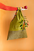 Hand-sewn green corduroy bag with contrasting lining