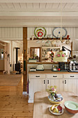 Country-house-style kitchen in cosy, open-plan interior