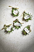 Christmas place cards made from rosemary circlets