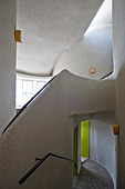 Stairwell and hallway with organically formed walls