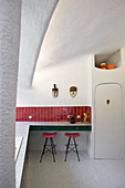 Retro kitchen in red and green with organically formed walls